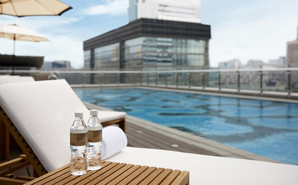 Отель Humble House Taipei, Curio Collection By Hilton Экстерьер фото The swimming pool at the hotel