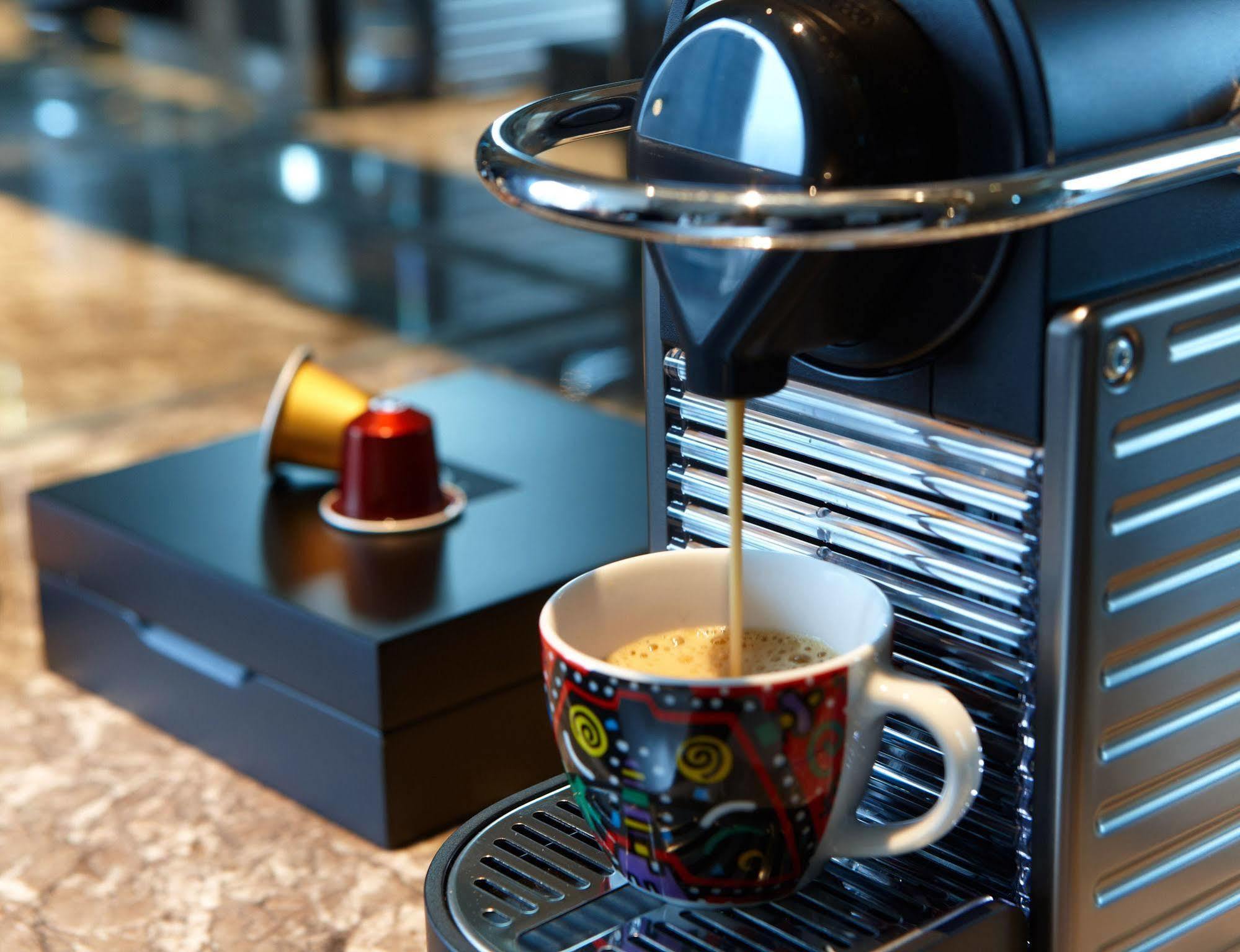 Отель Humble House Taipei, Curio Collection By Hilton Экстерьер фото A Nespresso machine